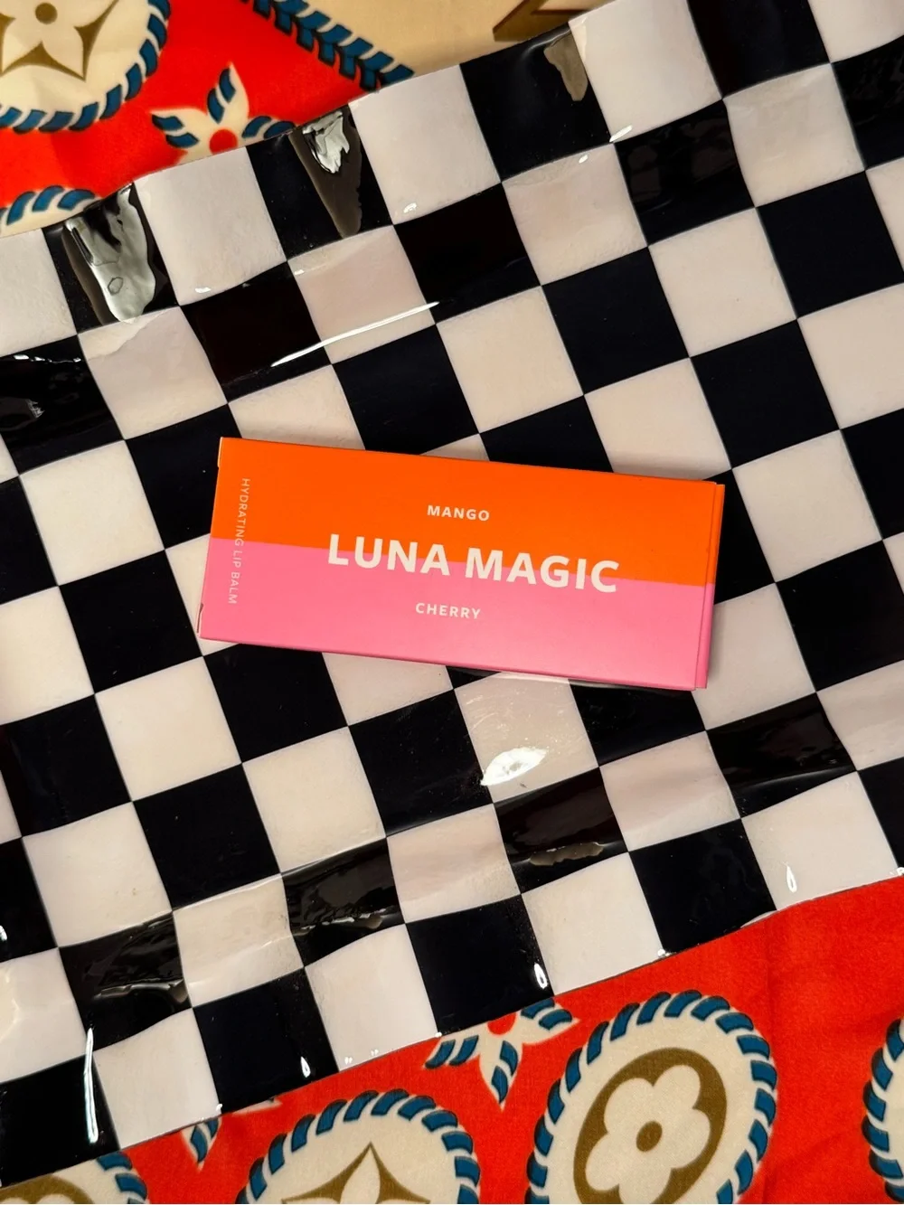 Mango LUNA MAGIC Hydrating Lip Balm Tubes in Orange and Red